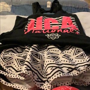UCA Cheer top and matching nylon shirts.